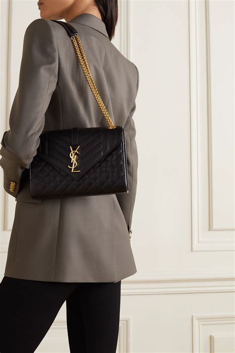 Check ModeSens before you buy Category Bags. . Black ysl bag